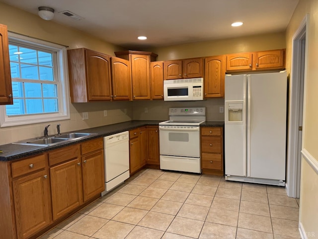 2004 Wards Ferry Rd Unit 15, Lynchburg, VA 24502 - kitchen with white appliances, dark countertops, light tile patterned flooring, brown cabinets, and recessed lighting