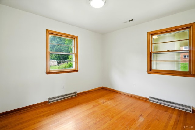 102 SE St, Brookneal, VA 24528 - spare room with a baseboard heating unit and light wood finished floors