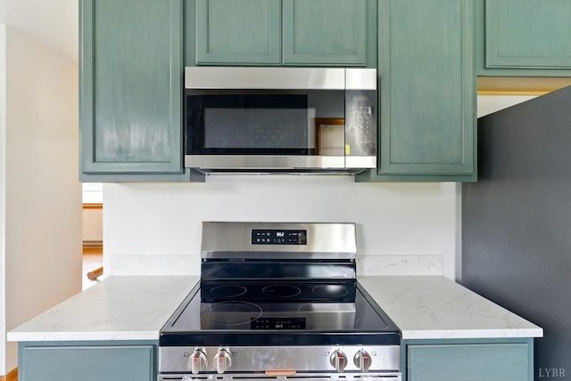 102 SE St, Brookneal, VA 24528 - kitchen with appliances with stainless steel finishes and light stone counters