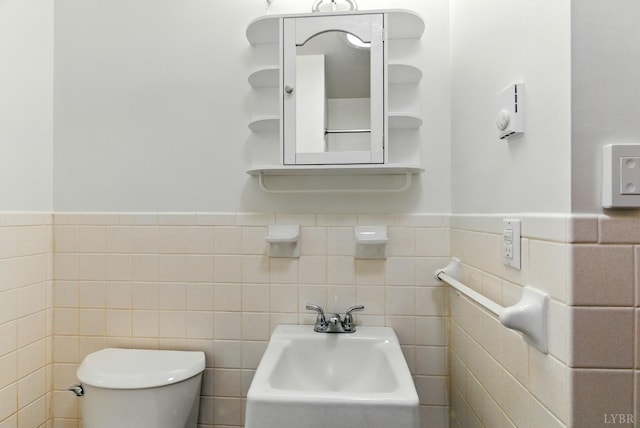 102 SE St, Brookneal, VA 24528 - half bath with tile walls and a wainscoted wall