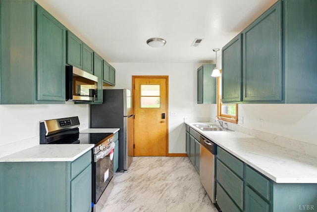 102 SE St, Brookneal, VA 24528 - kitchen featuring stainless steel appliances, healthy amount of natural light, green cabinetry, and light countertops