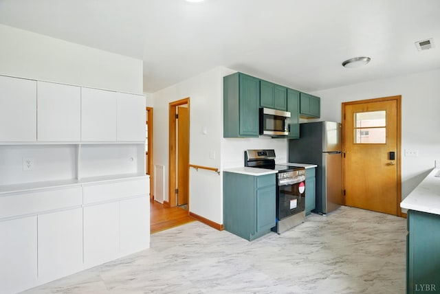 102 SE St, Brookneal, VA 24528 - kitchen with stainless steel appliances, light countertops, green cabinetry, white cabinetry, and light marble finish flooring