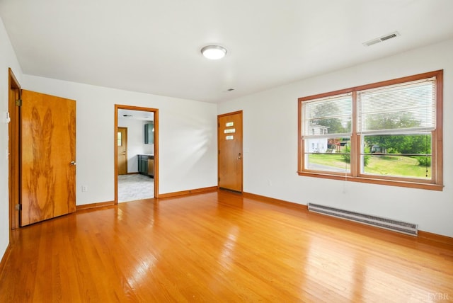 102 SE St, Brookneal, VA 24528 - empty room featuring baseboard heating and light wood-type flooring
