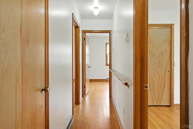 102 SE St, Brookneal, VA 24528 - hallway with light wood-style floors and a baseboard radiator