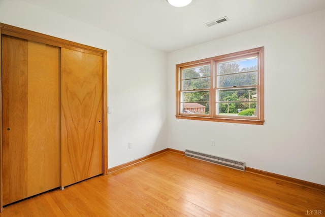 102 SE St, Brookneal, VA 24528 - unfurnished bedroom with light wood-type flooring and a closet
