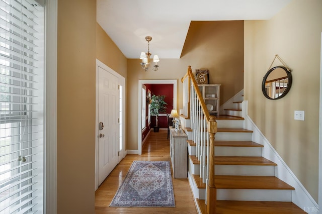 116 Wyndsong Pl, Lynchburg, VA 24502 - foyer with a chandelier, stairway, and light wood-style floors