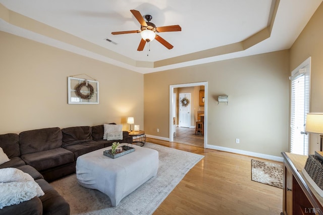 116 Wyndsong Pl, Lynchburg, VA 24502 - living area featuring a ceiling fan, a tray ceiling, and light wood finished floors