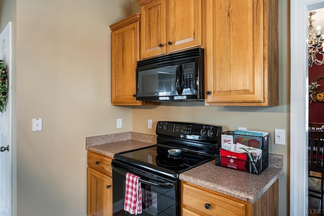 116 Wyndsong Pl, Lynchburg, VA 24502 - kitchen featuring black appliances and brown cabinets