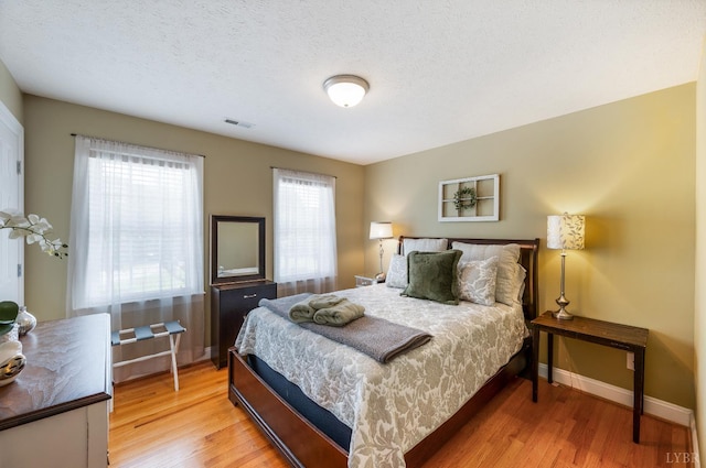 116 Wyndsong Pl, Lynchburg, VA 24502 - bedroom featuring wood finished floors and a textured ceiling