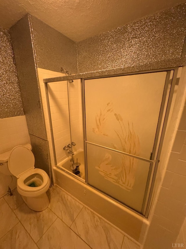 512 Polk St, Lynchburg, VA 24504 - bathroom with combined bath / shower with glass door, marble finish floors, a textured ceiling, and tile walls