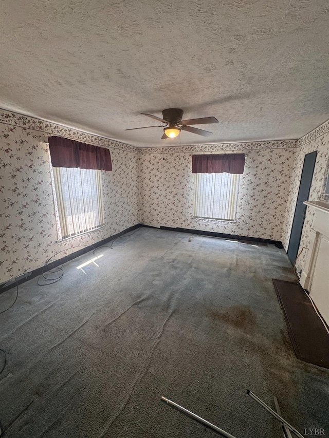 512 Polk St, Lynchburg, VA 24504 - carpeted spare room featuring wallpapered walls, a textured ceiling, plenty of natural light, and a ceiling fan