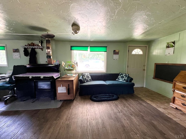 8288 Red House Rd, Phenix, VA 23959 - living room with wood finished floors and a textured ceiling