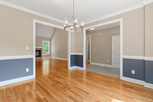 1290 Ivy Creek Dr, Forest, VA 24551 - empty room with a chandelier, light wood-style flooring, crown molding, and a fireplace