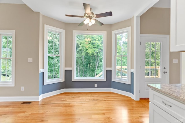 1290 Ivy Creek Dr, Forest, VA 24551 - unfurnished dining area with light wood-style flooring, plenty of natural light, and a ceiling fan