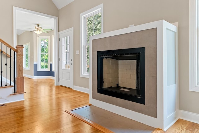1290 Ivy Creek Dr, Forest, VA 24551 - entrance foyer featuring wood finished floors, stairway, a fireplace, vaulted ceiling, and plenty of natural light