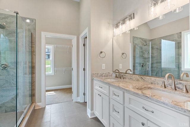 1290 Ivy Creek Dr, Forest, VA 24551 - full bathroom with a stall shower, double vanity, a spacious closet, and tile patterned flooring