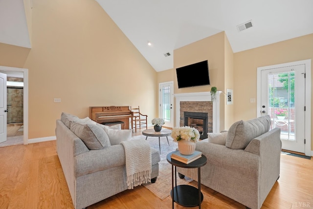 403 Cornerstone St, Lynchburg, VA 24502 - living area with a fireplace, high vaulted ceiling, and light wood-style floors