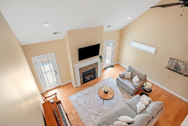 403 Cornerstone St, Lynchburg, VA 24502 - living area with plenty of natural light, light wood-type flooring, ceiling fan, a fireplace, and vaulted ceiling