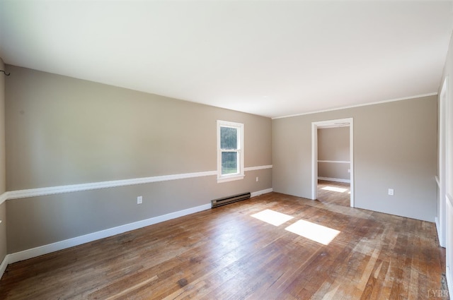 4550 Pumping Station Rd, Appomattox, VA 24522 - spare room featuring baseboard heating and wood-type flooring