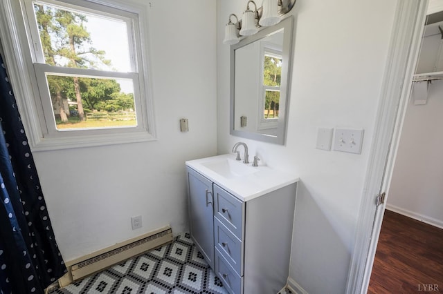 4550 Pumping Station Rd, Appomattox, VA 24522 - bathroom featuring a baseboard heating unit, vanity, a chandelier, and wood finished floors