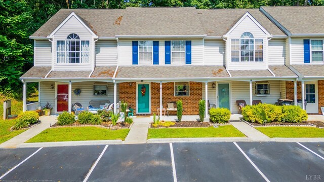 17 Jefferson Village Dr, Forest, VA 24551 - townhome / multi-family property with covered porch, uncovered parking, and brick siding