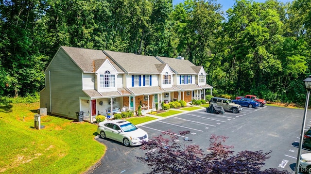 17 Jefferson Village Dr, Forest, VA 24551 - view of property with a porch, uncovered parking, and a front yard