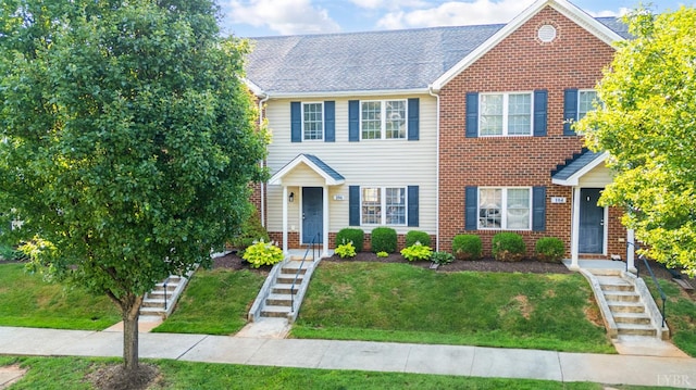 106 Colonnade St, Lynchburg, VA 24502 - view of front of property with stairs, a front yard, and brick siding