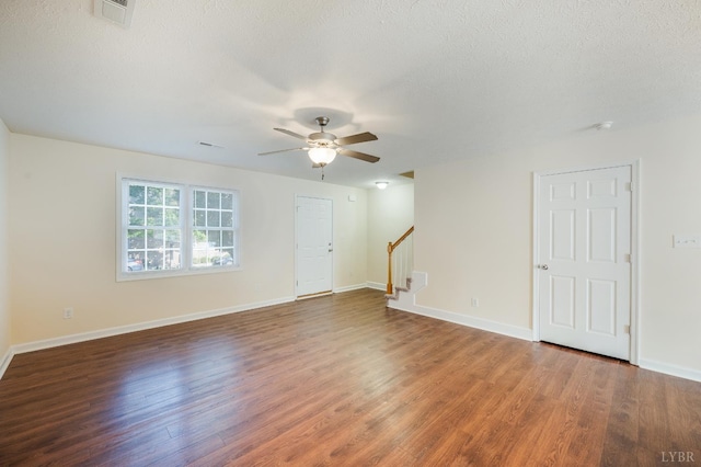 106 Colonnade St, Lynchburg, VA 24502 - unfurnished living room featuring wood finished floors, a ceiling fan, stairway, and a textured ceiling