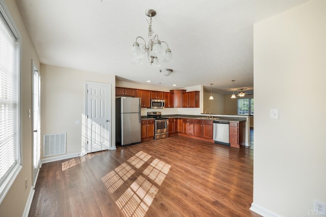 106 Colonnade St, Lynchburg, VA 24502 - kitchen with appliances with stainless steel finishes, dark wood finished floors, a chandelier, decorative light fixtures, and recessed lighting