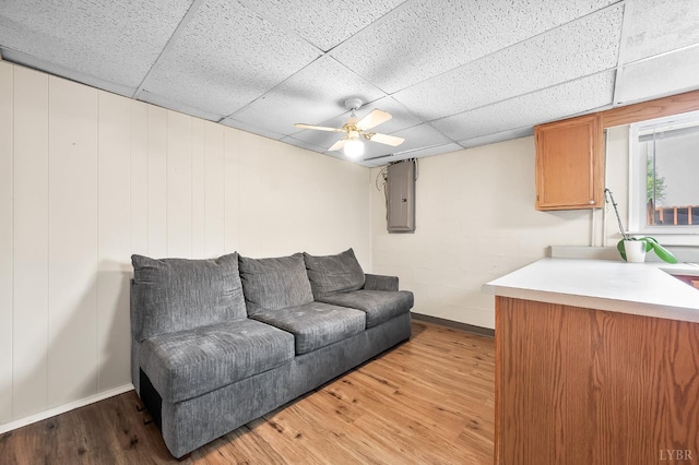 1246 Rainbow Forest Dr, Lynchburg, VA 24502 - living room featuring a drop ceiling, light wood-style flooring, electric panel, and ceiling fan