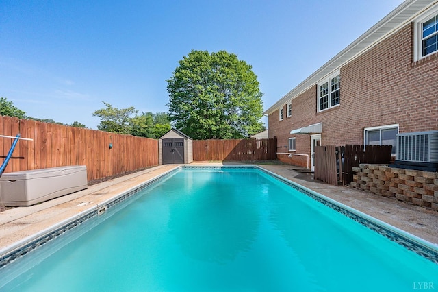1246 Rainbow Forest Dr, Lynchburg, VA 24502 - view of swimming pool with a storage unit and a fenced backyard