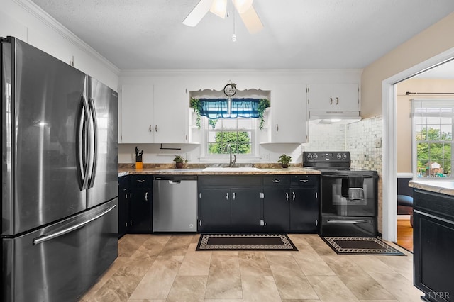 1246 Rainbow Forest Dr, Lynchburg, VA 24502 - kitchen featuring stainless steel appliances, under cabinet range hood, dark cabinets, white cabinets, and crown molding
