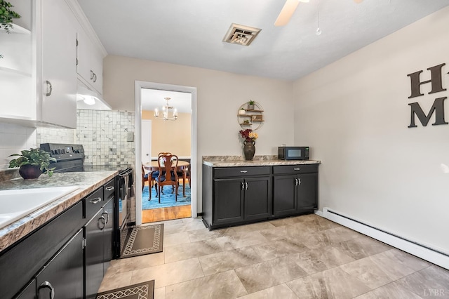 1246 Rainbow Forest Dr, Lynchburg, VA 24502 - kitchen featuring black appliances, a baseboard heating unit, backsplash, and light countertops