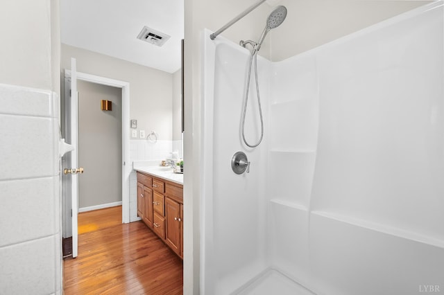 1246 Rainbow Forest Dr, Lynchburg, VA 24502 - full bath featuring wood finished floors, a shower, and double vanity