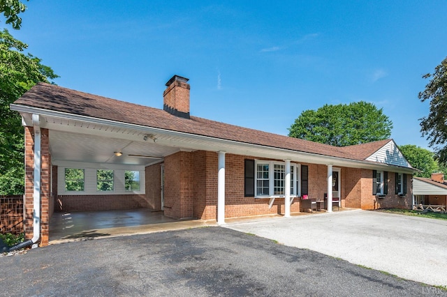 1246 Rainbow Forest Dr, Lynchburg, VA 24502 - single story home with brick siding, a chimney, asphalt driveway, and a carport