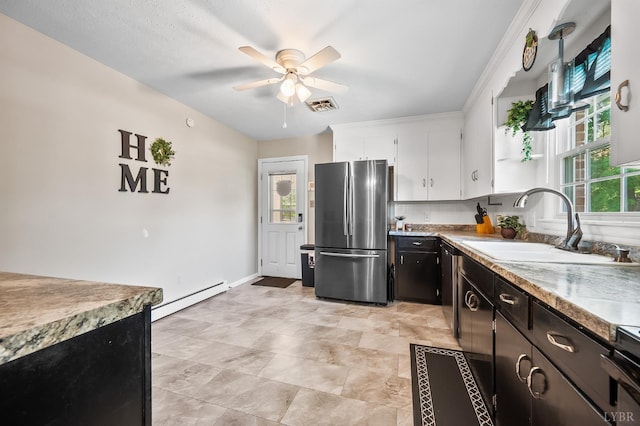 1246 Rainbow Forest Dr, Lynchburg, VA 24502 - kitchen featuring freestanding refrigerator, a baseboard heating unit, a ceiling fan, white cabinets, and light countertops