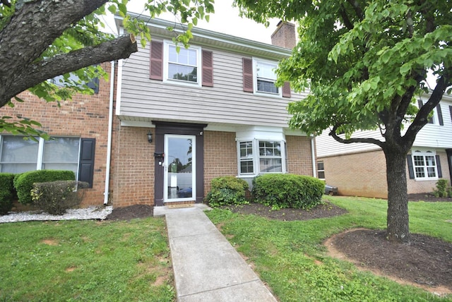 112 E Cadbury Dr, Lynchburg, VA 24501 - view of front facade featuring a front lawn, a chimney, and brick siding