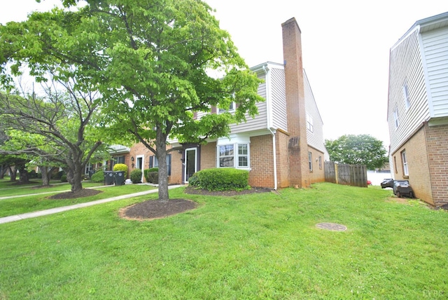 112 E Cadbury Dr, Lynchburg, VA 24501 - view of property with brick siding and a chimney