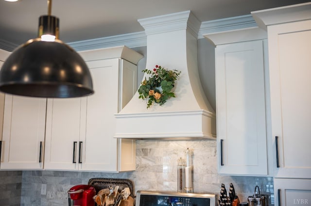 1010 Coles Ct, Forest, VA 24551 - kitchen view of tasteful backsplash, white cabinetry, ornamental molding, and premium range hood