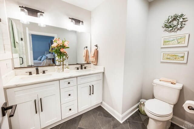 1010 Coles Ct, Forest, VA 24551 - full bath with double vanity, ensuite bathroom, marble look tiles, and a shower with door