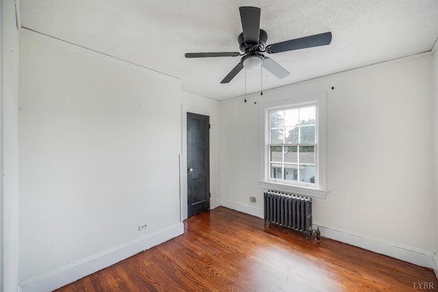 1614 Early St, Lynchburg, VA 24503 - spare room with radiator heating unit, wood finished floors, and ceiling fan