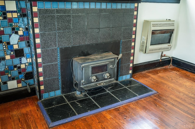 1614 Early St, Lynchburg, VA 24503 - detailed view of heating unit, a wood stove, and wood finished floors