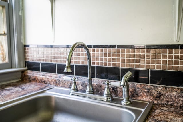 1614 Early St, Lynchburg, VA 24503 - detailed view of tasteful backsplash, dark countertops, and white cabinets