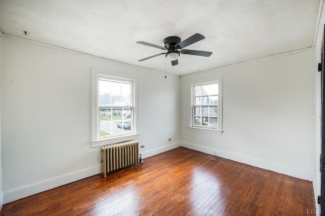 1614 Early St, Lynchburg, VA 24503 - empty room with radiator, wood finished floors, and ceiling fan