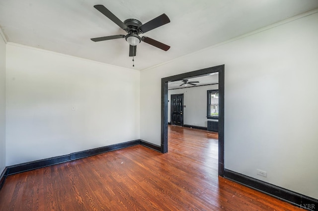 1614 Early St, Lynchburg, VA 24503 - empty room featuring radiator heating unit, crown molding, dark wood-style flooring, and a ceiling fan