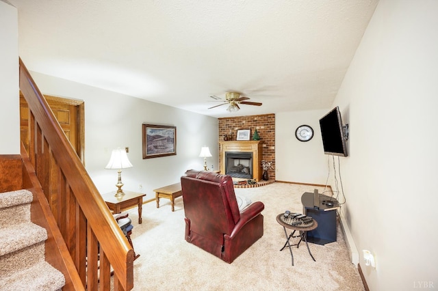 1159 Cifax Rd, Forest, VA 24551 - carpeted living room with a ceiling fan, stairs, and a brick fireplace