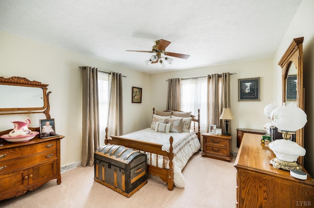 1159 Cifax Rd, Forest, VA 24551 - bedroom featuring multiple windows, light carpet, ceiling fan, and a textured ceiling