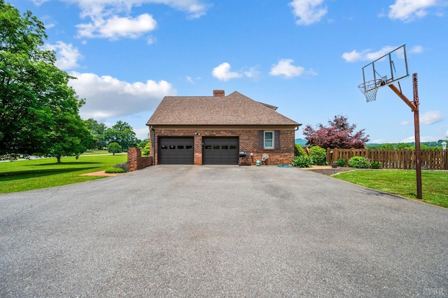 1159 Cifax Rd, Forest, VA 24551 - view of home's exterior featuring driveway, a garage, brick siding, a chimney, and roof with shingles