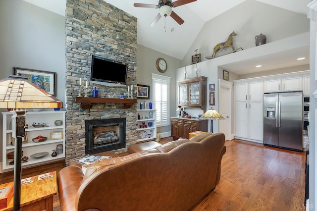 1424 Lake Manor Dr, Forest, VA 24551 - living area with a ceiling fan, a stone fireplace, wood finished floors, and high vaulted ceiling