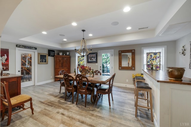 1424 Lake Manor Dr, Forest, VA 24551 - dining space featuring a raised ceiling, light wood-style floors, recessed lighting, and a chandelier